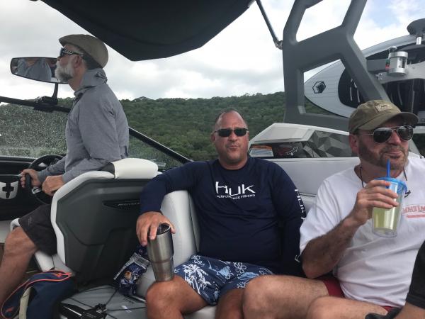 three men on a boat